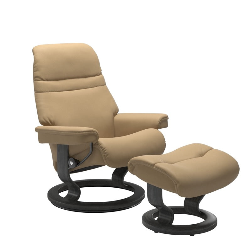 Sand colored sunrise recliner with matching ottoman both featuring a circular base in grey wood. 