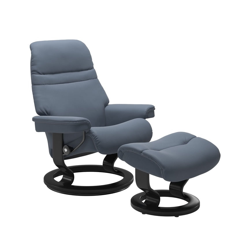Sparrow Blue colored sunrise recliner with matching ottoman both featuring a circular base in black wood. 