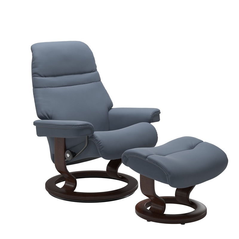 Sparrow blue colored sunrise recliner with matching ottoman both featuring a circular base in brown wood 