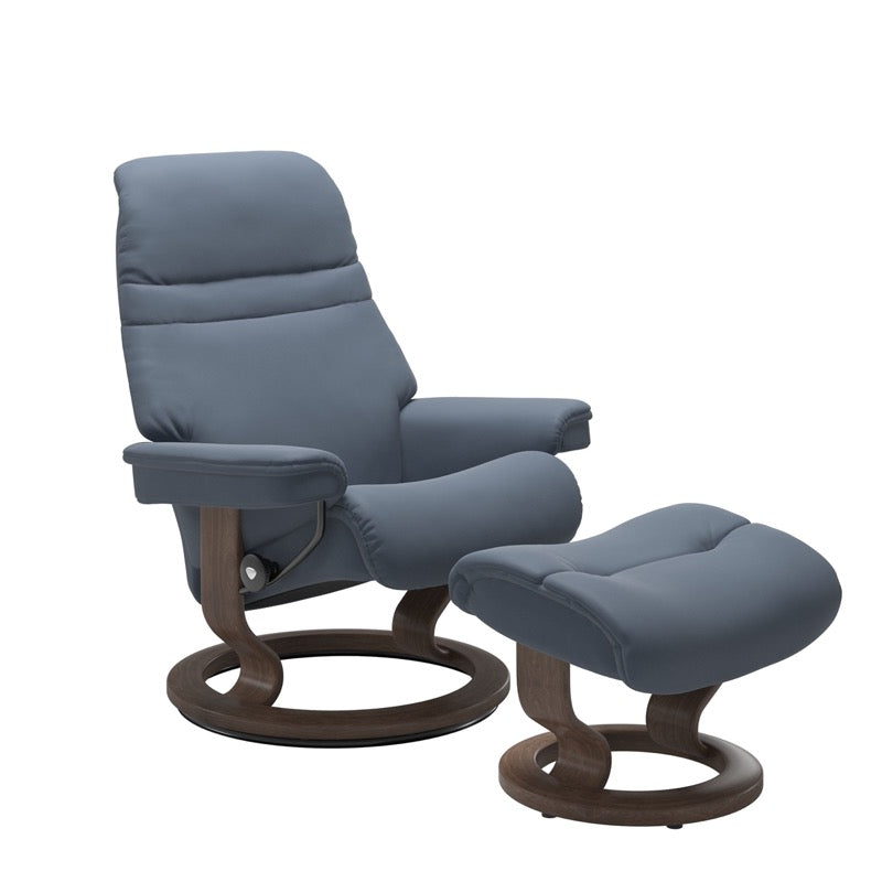 Sparrow Blue colored sunrise recliner with matching ottoman both featuring a circular base in walnut wood. 