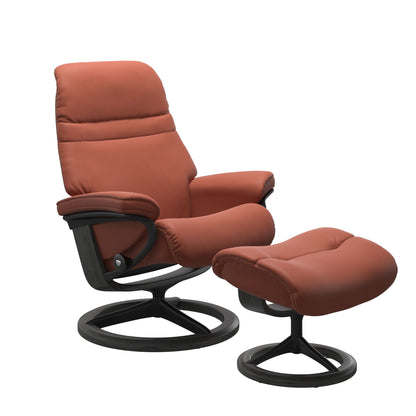 Henna colored sunrise recliner with matching ottoman featuring a curved base in metal and grey