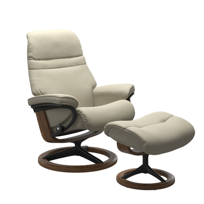 Light Grey colored sunrise recliner with matching ottoman featuring a curved base in metal and teak