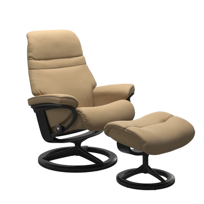 Sand colored sunrise recliner with matching ottoman featuring a curved base in metal and black