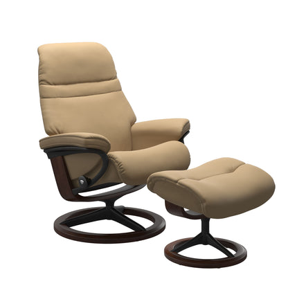 Sand colored sunrise recliner with matching ottoman featuring a curved base in metal and brown