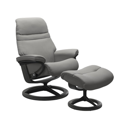Silver Grey colored sunrise recliner with matching ottoman featuring a curved base in metal and grey