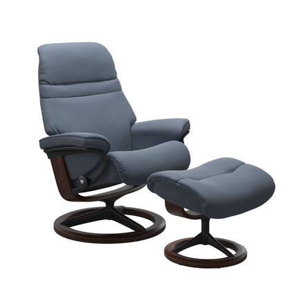 Sparrow Blue colored sunrise recliner with matching ottoman featuring a curved base in metal and brown