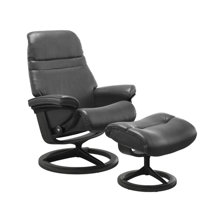 Pioneer Grey colored sunrise recliner with matching ottoman featuring a curved base in metal and grey