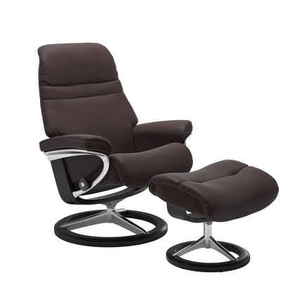 Chocolate colored sunrise recliner with matching ottoman featuring a curved  black wood and metal base