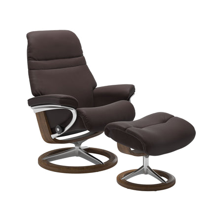 Chocolate colored sunrise recliner with matching ottoman featuring a curved  teak wood and metal base
