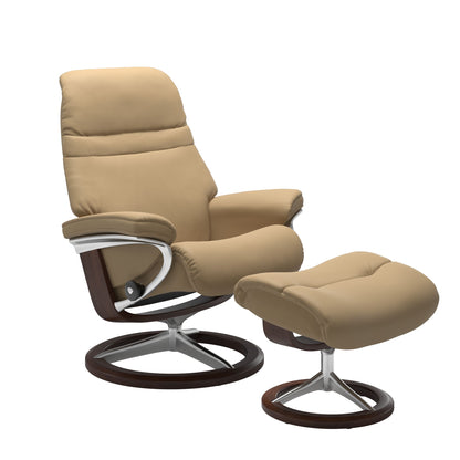 Sand colored sunrise recliner with matching ottoman featuring a curved  brown wood and metal base