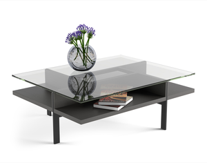 Modern glass top rectangle coffee table with charcoal stained ash wooden shelf and black metal legs. 